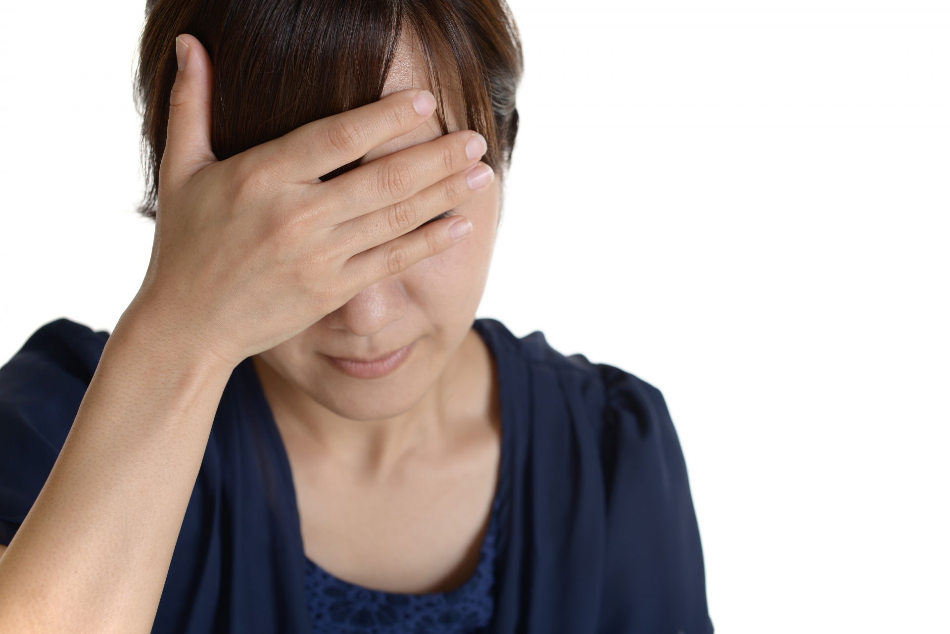頭に手をあてる人